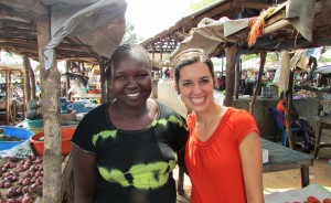 Theresa, right, and Mary, her language helper, next to Mary’s booth at the Mundri market. | Photo by Will and Theresa Reed