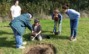 Amy Roche (second from right), the orchard’s outreach chair and chair of the board of directors, strives to dream, build, and share an orchard community with visitors. | Photo courtesy of Bloomington Community Orchard