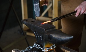Terran Marks, resident blacksmith and owner of Brown County Forge, working in the Ingot Workshop at Artisan Alley, an artist collective on South Rogers Street. | Photo by Natasha Komoda