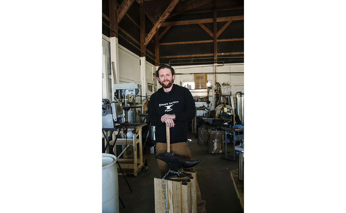 Terran Marks, resident blacksmith and owner of Brown County Forge, in his studio. | Photo by Natasha Komoda