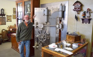 Carriage House Antiques is a combination of a museum, ice-creamery, and a trinket garrison. The proprietor, Tom Meyer (pictured here), provides tours of the building, which was once a bank. | Photo by Michael Waterford