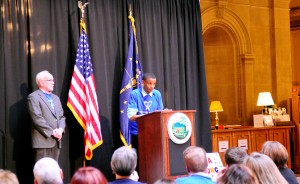 Dorian Phillips shares his experience in the Monroe County CASA program at the CASA Day rally at the Indiana Statehouse in March. His CASA of three years, Jim Shelton, stands with him in support. | Photo by Ann Georgescu