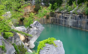 Indiana Limestone Company has considered demolishing the slab of stone, but it wouldn’t stop people from jumping off other ledges and swimming in the quarry anyway. | Photo by Lynae Sowinski