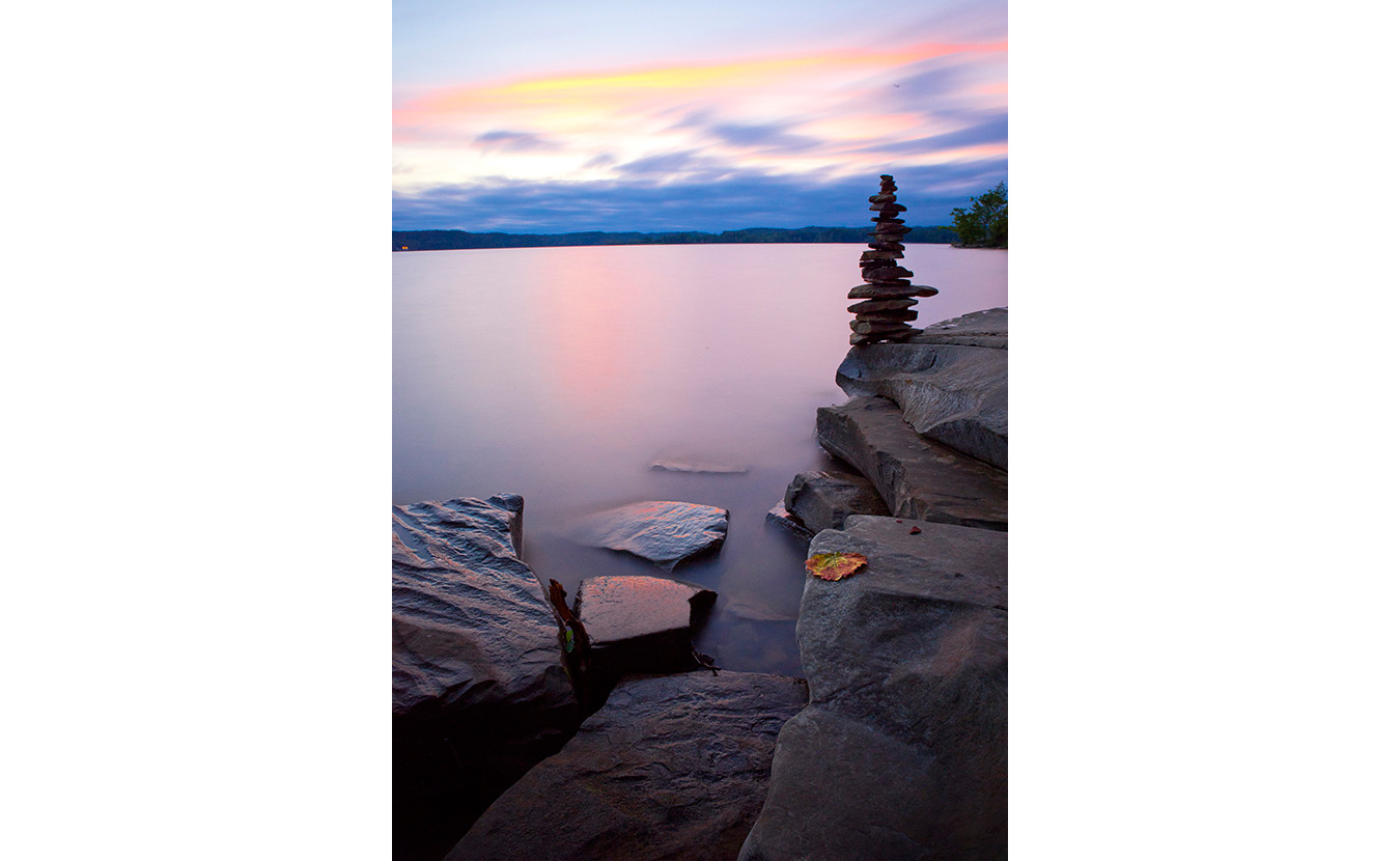 Clark used a 10-stop neutral density filter, which reduces the amount of light that hits the camera’s light sensors allowing for a wider aperture, to get this photo of Flat Rock beach on Lake Monroe. | Photo by Nathan Clark