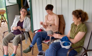 Lindsay shares a laugh with fellow knitters, Faith Hawkins (left) and Karen Ellis, as they try out the Marble Hill Farm yarn for the first time. | Photo by Samuel Welsch Sveen