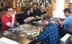 A group of gamers plays "Warhammer 40,000: Conquest" at The Common Room. | Limestone Post