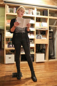 Poet Michelle Gottschlich performs at a poetry reading. | Photo by Whitney Walker