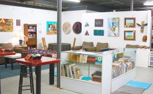 The busy space of Dimensions Gallery has a little bit of everything: art, books, games, and music. | Photo by Samuel Welsch Sveen