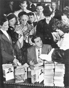 Writer Ross Lockridge Jr. (RLJ), killed himself on March 6, 1948, just two months after his book "Raintree County" was published. RLJ, pictured here is signing autographs at an L. S. Ayres department store in Indianapolis on January 20, 1948. This is the last known photograph of RLJ. | Photo by Robert Lavelle, The Indianapolis News, courtesy of Larry Lockridge