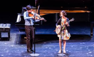Nashville-based brother/sister bluegrass duo Giri Peters, age 12, and Uma Peters, 10, will perform at Lotus on September 29. | Photo courtesy of Rinku
