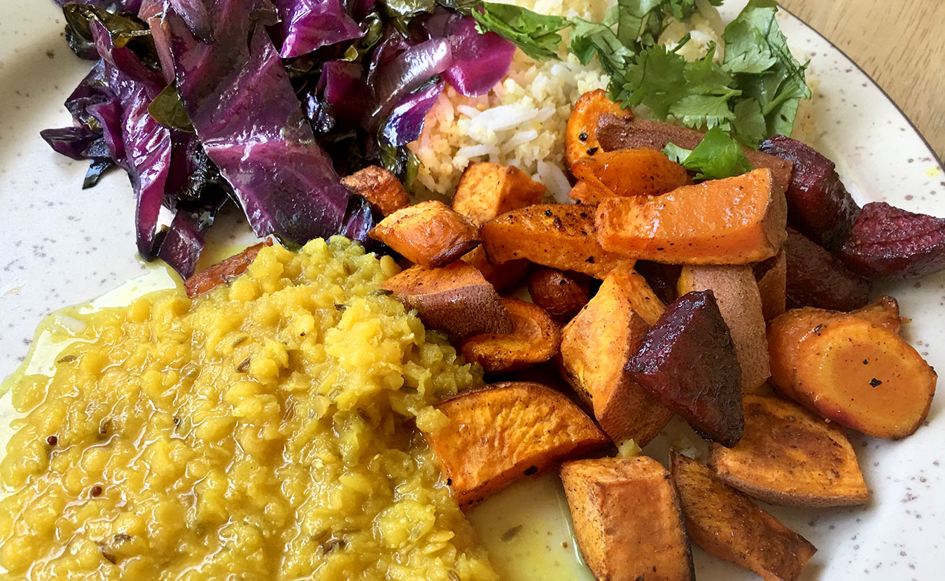 Health educator and certified Ayurvedic practitioner Kristin Londergan’s roasted root veggies and red lentil dal with cabbage, rice, and millet. | Photo by Ruthie Cohen