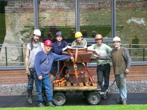 Iron casting crew in front of the historic Telford furnace in Coalbrookdale, England at the International Conference of Contemporary Cast Iron Art 2009. From left, Chris Johns, Rick Batten, Will Vannerson, Nate Hensley, Chris Gerber and Gerry Masse. The crew stands with Lady Dianne, the furnace they built, now in use at Sculpture Trails Outdoor Museum in Solsberry. | Courtesy photo