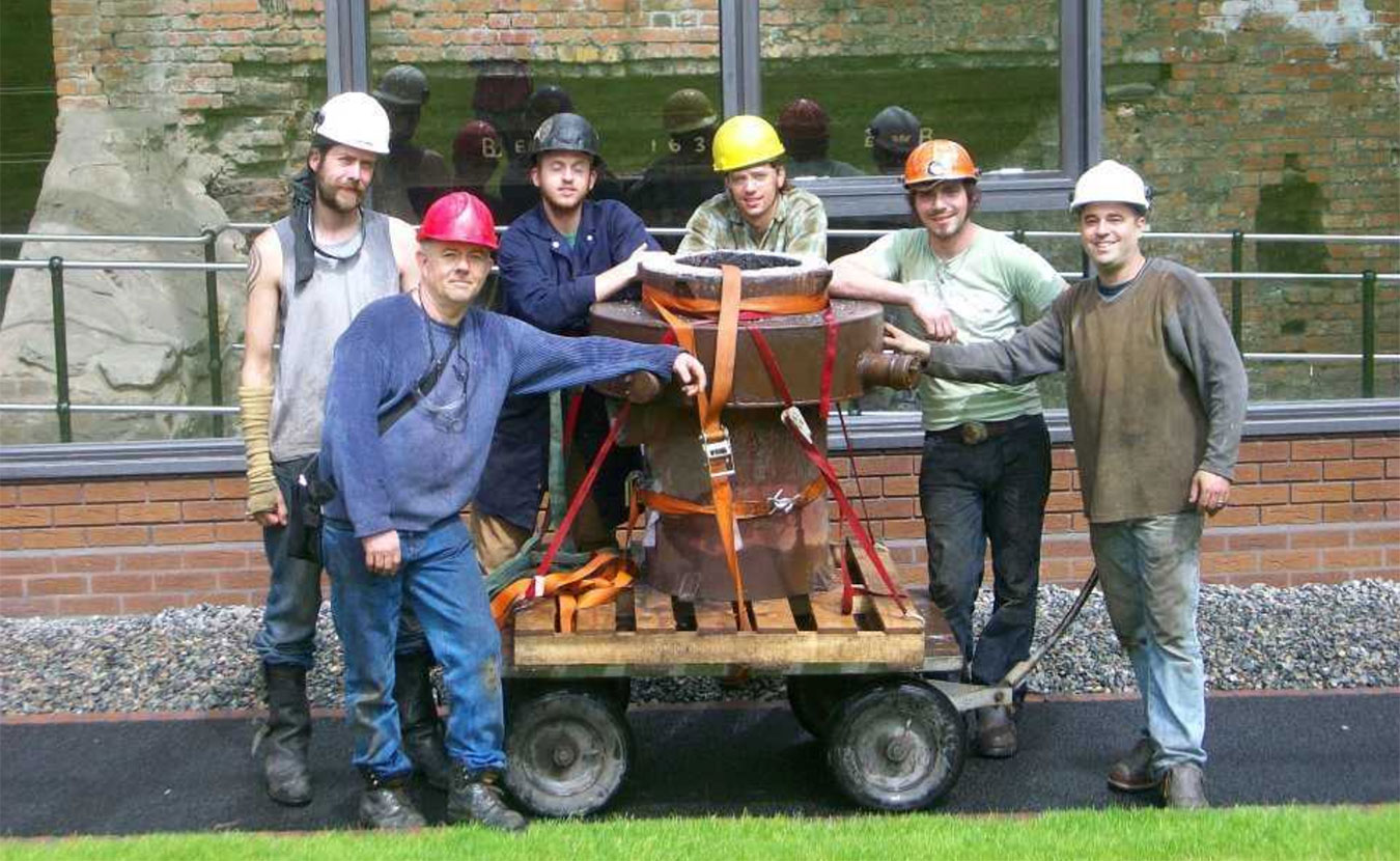 Iron casting crew in front of the historic Telford furnace in Coalbrookdale, England, at the International Conference of Contemporary Cast Iron Art 2009. From left, Chris Johns, Rick Batten, Will Vannerson, Nate Hensley, Chris Gerber, and Gerry Masse. The crew stands with Lady Dianne, the furnace they built, now in use at Sculpture Trails Outdoor Museum in Solsberry. | Courtesy photo