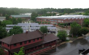 Installing solar panels in parking lots, such as at Showers Commons (pictured here) and on the roofs of buildings would allow the university to have enough solar energy to meet a large portion of its energy load without the need for any new real estate. | Limestone Post