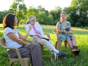 Lana, right, speaks with, left to right, Marilyn and Nancy (a founder) during a council meeting in 2017. | Limestone Post