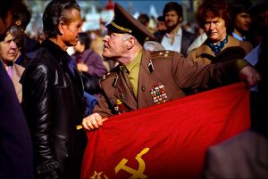 Shouting "traitor," a flag-waving colonel of the Soviet Army confronts a pro-democracy demonstrator at a May Day parade on Red Square in 1990. Hundreds of thousands of Soviet citizens turned a working-class holiday into an angry display of popular discontent with a communist rule — a movement that would lead to the dissolution of the Soviet Union in December 1991. | © Steve Raymer / National Geographic Creative