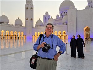 Photojournalist and professor Steve Raymer at the Sheikh Zayed Grand Mosque in Abu Dhabi, one of the world’s largest mosques that can accommodate more than forty thousand worshippers. In 2017, the mosque was ceremonially renamed after the mother of Jesus Christ — Mariam, Umm Eisa, Arabic for “Mary, the mother of Jesus.” Sheikh Mohammed Bin Zayed Al Nahyan, crown prince of Abu Dhabi, says he ordered the change to build bridges to other religions. | Photo courtesy of Steve Raymer