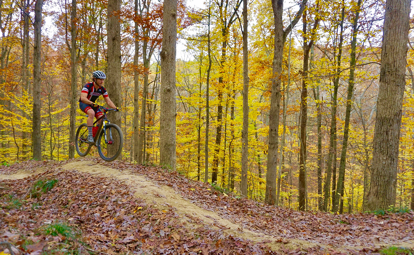 While the city’s biking infrastructure leaves much to be desired, Bloomington has plenty more to back its claim as the Biking Capital of the Midwest, argues writer and avid biker Sean Starowitz. Pictured here, biker Jesse Smith rides on Hobbs Hollow Flow Trail in Brown County State Park. | Photo by Devin O’Leary