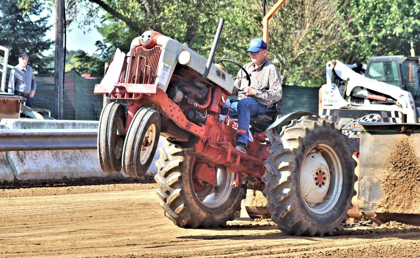 If you’re looking to escape the weekend crowds this month, two massive festivals in two tiny towns might just be the ticket. The White River Valley Antique Show and the Lanesville Heritage Weekend are chockfull of authentic Hoosier heritage and late-summer fun. The antique tractor pull, pictured here in Lanesville, is a popular event. | Photo courtesy of the Lanesville Heritage Society