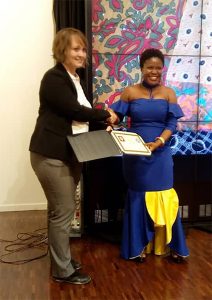 Eastina receives her certificate during the 2018 Mandela Washington Fellowship graduation ceremony. | Courtesy photo