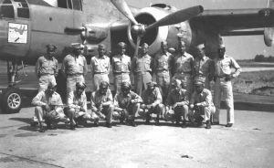 477th pilots and ground officers with one of their B-25 bombers. | Public domain