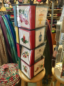 Quilled holiday cards by an artisan collective in [what country? Do you know the name of the collective?] are made with finesse and careful attention to detail. [do you get these cards from Ten Thousand Villages?]