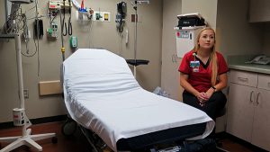 Kristyn Frisk is a SANE at IU Health, where she routinely preforms three to five hour evidentiary exams. Frisk makes sure each survivor knows they are in charge of their own exam by asking for permission to proceed at every step of the process. | Nicole McPheeters