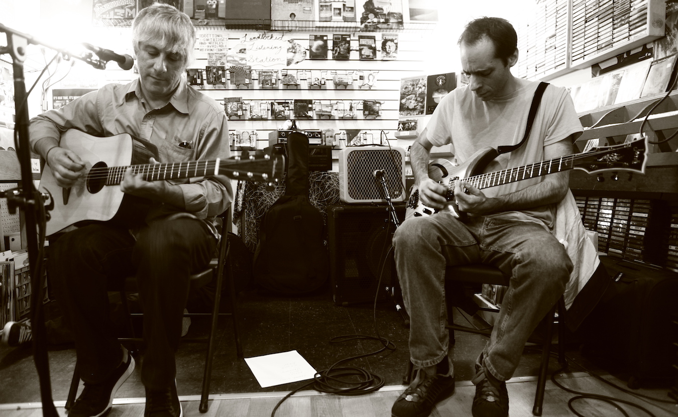 Lee Ranaldo (left) of Sonic Youth plays at Landlocked Music in 2012. Ranaldo also recited a poem about Bloomington that he had written in 1990. Landlocked has hosted about 50 in-store performances since it opened in 2006. | Photo by Jeremy Hogan