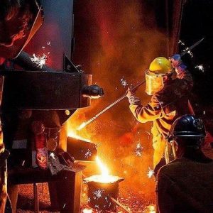 In July, Sculpture Trails Outdoor Museum holds its annual monthlong series of workshops and public events in Greene County, capped by the Fire@Nite Iron Pour on July 27. (in yellow hardhat) Sculpture Trails founder Gerry Masse works one of the iron furnaces. | Courtesy photo