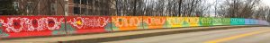 (17) Maple Heights Bridge (2017), 850 N. Rogers Street (the bridge's wall on the other side of the street is also painted), artists — members of Rhino’s Youth Center | Photo by Limestone Post