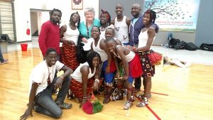 The dance troupe Dance of Hope with their Bloomington host, Kathy Aiken (back row, third from left) | Photo courtesy of Lotus Education & Arts Foundation