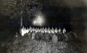 While the Ku Klux Klan in Indiana peaked nearly 100 years ago, its members’ support of Christian nationalism is reflected in various political, militia, and hate groups today. Writer Laurie D. Borman interviewed several experts who suggest the ideologies espoused by today’s far-right groups is a continuation of the country’s racist past. This photo is of a KKK cross burning in northern Indiana in 1922.
