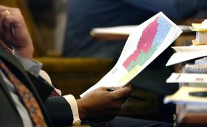 Mississippi State Sen. Joseph Thomas, D-Yazoo City, holds a copy of the proposed congressional redistricting map during debate over redistricting at the Mississippi State Capitol in Jackson, January 12, 2022. | AP Photo/Rogelio V. Solis