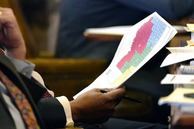 Mississippi State Sen. Joseph Thomas, D-Yazoo City, holds a copy of the proposed congressional redistricting map during debate over redistricting at the Mississippi State Capitol in Jackson, January 12, 2022. | AP Photo/Rogelio V. Solis