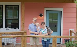 Alex and Kate Burch with their daughter, Caroline, at their home in the Bloomington Cohousing community, experienced pandemic life in both a traditional neighborhood and a cohousing neighborhood. | Photo by Laura Turner Photography