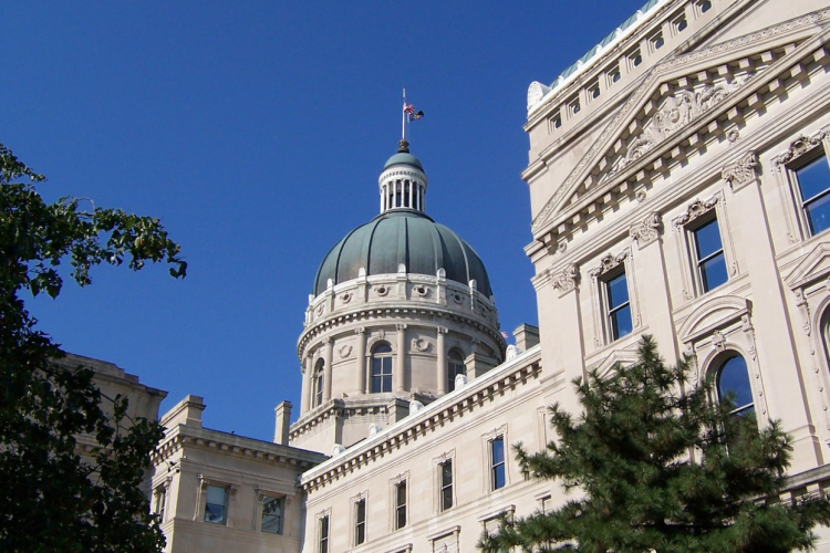 By means of partisan gerrymandering, the Indiana legislature has violated the democratic principle of one person, one vote, says retired Indiana University Professor Emeritus Jim Allison. Proportional representation, he says, would help to give Hoosiers “free and fair” elections, as required by the state constitution. | Photo of the Indiana Statehouse via Wikimedia Commons, CC BY-SA 3.0; the original uploader was Jasont82 at English Wikipedia.