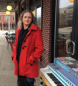 Emily Morgan, outside of her neighborhood coffee shop, is moving out of Monroe County because the rent on the house she and her partner lived in for ten years on the southside of Bloomington increased by $800, or 77 percent, per month. | Limestone Post