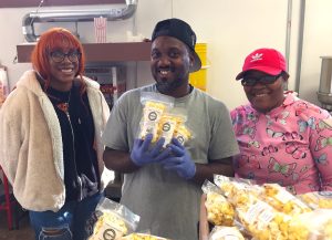 Part of the PopKorn Kernel crew: (l-r) Staffer Maria Evans, Manager Frederick Bennett, Mall Store Manager LaShae Lewis. | Limestone Post