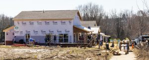 Workers build a house in the Osage Place neighborhood, adjacent to RCA Community Park. Since 1988, Habitat for Humanity of Monroe County has built more than 220 homes and housed more than 815 people. | Photo by Jim Krause 