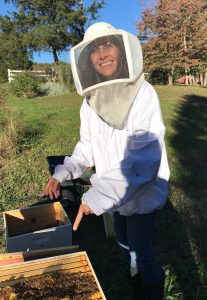 Erin started tending honey bees as a way to spend time with beekeeping friends and to complement her other conservationist activities. | Photo by Andy Hollinden