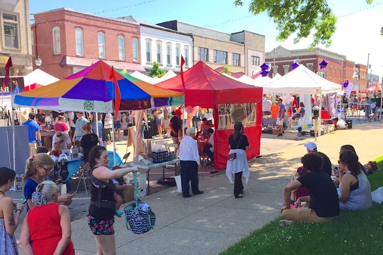 Artist tents line 6th Street in front of the Monroe County Courthouse at a previous Arts Fair on the Square. The event is returning to Bloomington on June 24, from 10 a.m. to 5 p.m. Visitors can connect with artists and participate in a variety of interactive arts experiences.