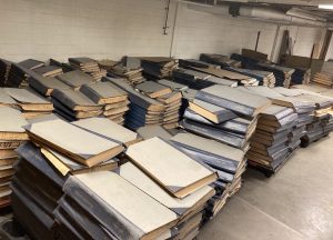 Books of old newspapers were stored in a room — known as “the morgue” — in the basement of the former Herald-Times building on South Walnut. The books are now stored at Cook Medical, where they await auction. | Photo by Jill Bond.