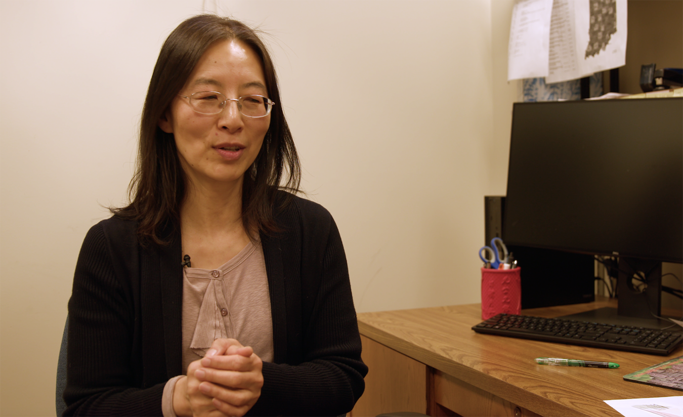 Dr. Sa Liu discussing the results of her pilot health study in her office at Purdue University