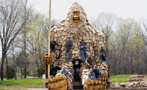 Otis, a 25-foot-tall sasquatch at Patoka Lake, has become a tourist sensation in Orange County, drawing tourists from across the state and beyond. He was completed in April 2023 by the Bear Hollow carving team (pictured above, with the big guy). | Photo provided