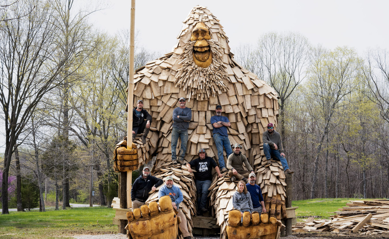 Otis, a 25-foot-tall sasquatch at Patoka Lake, has become a tourist sensation in Orange County, drawing tourists from across the state and beyond. He was completed in April 2023 by the Bear Hollow carving team (pictured above, with the big guy). | Photo provided