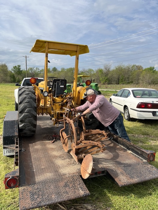 Kevin Zikes unloads his equipment for plow day.
