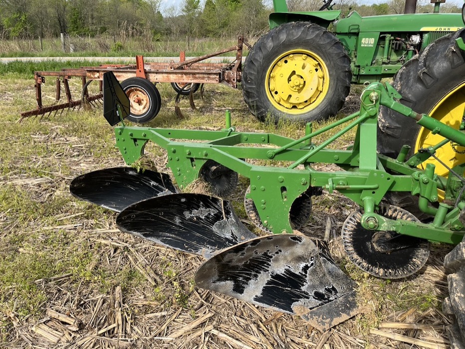 Equipment of any age can be part of the Monroe County Antique Machinery Association. In the background is a chisel plow and in the foreground a moldboard plow.