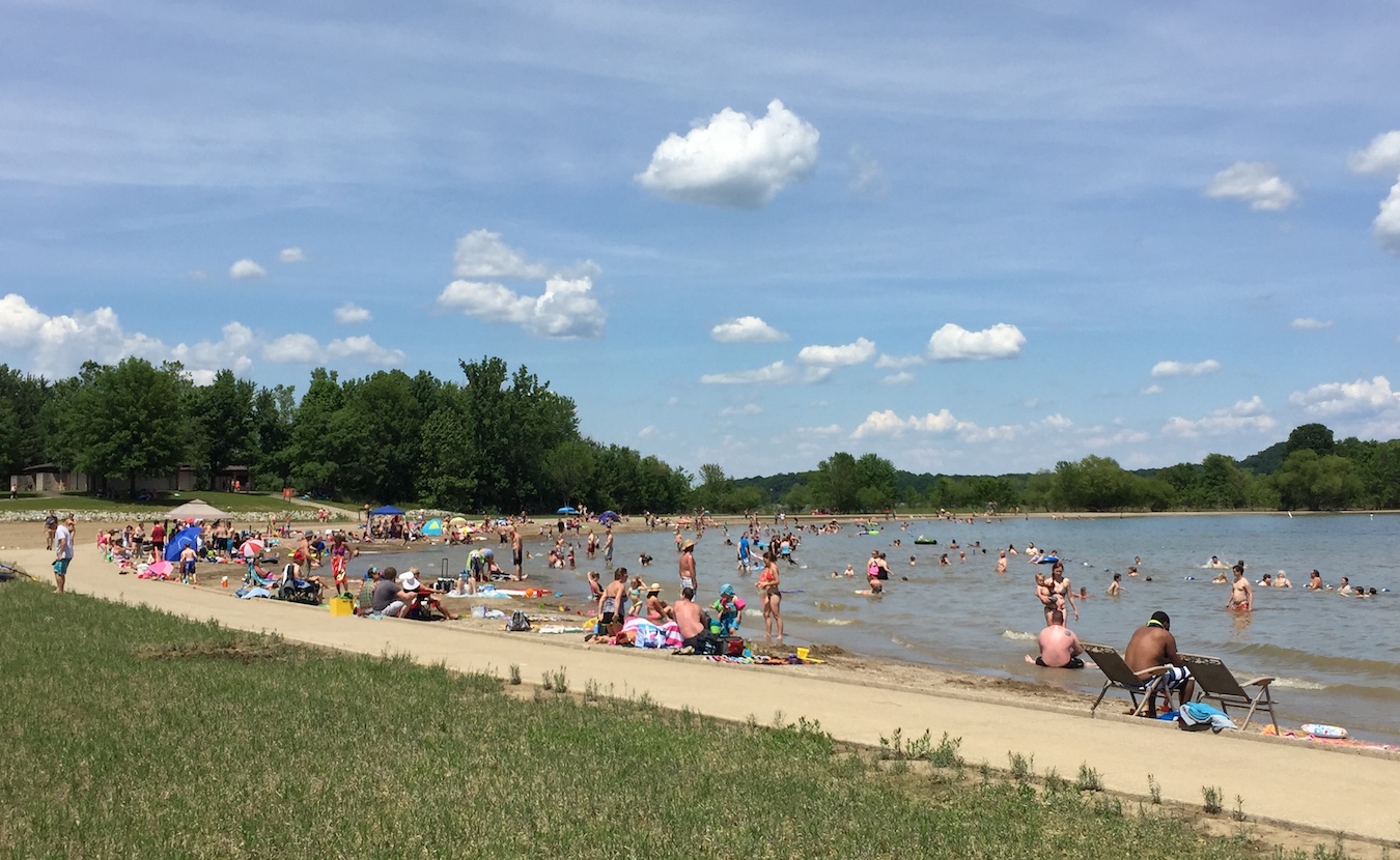 Monroe Lake is “the source of our drinking water, a destination for many outdoor activities, and home to a wide variety of critters and flora,” writes Michael G. Glab. This year marks the 60th anniversary of its dedication, and many events are planned to commemorate it. Above, swimmers enjoy the beach at Fairfax State Recreation Area. | Limestone Post