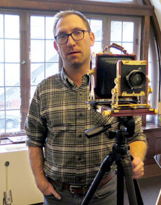 Adam Reynolds with his 4×5 field camera. | Limestone Post